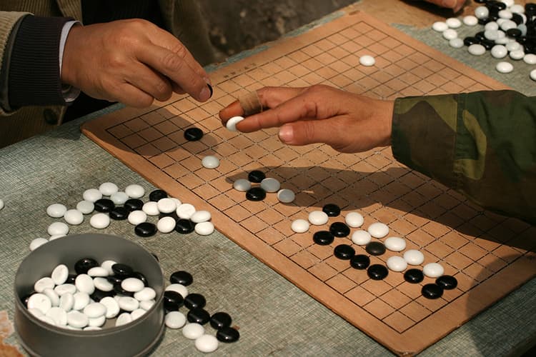 Playing Weiqi